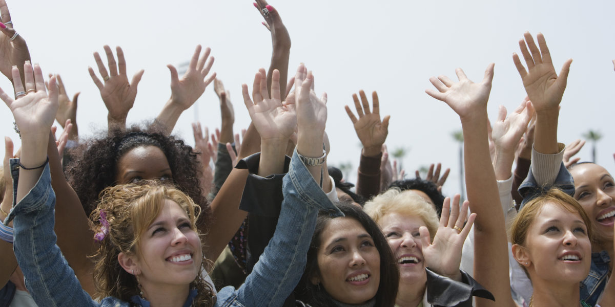 women raising hands herd mentality